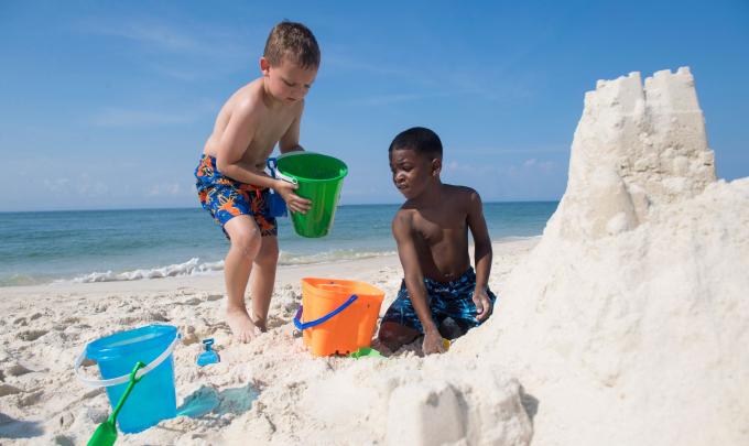 Kids building sandcastles in Gulf Shores, AL