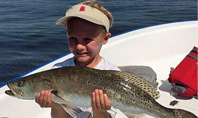 Little boy with a big trout in Gulf Shores, AL
