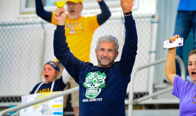 Dad cheering daughter on during NAIA Women's Soccer Championship in Gulf Shores, AL