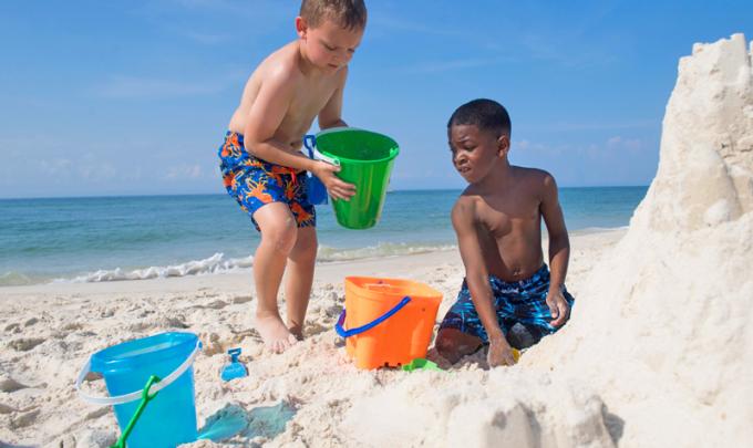 Boys playing on Alabama's Beaches