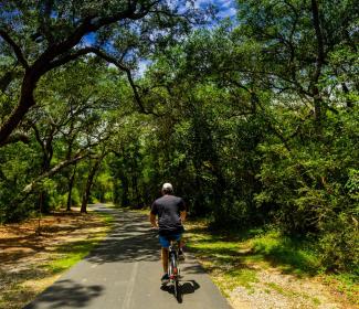 Man biking on trails in Gulf Shores, AL