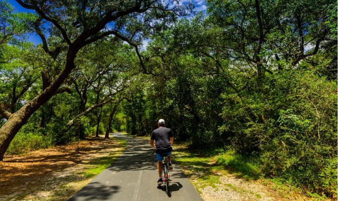 Man biking on trails in Gulf Shores, AL