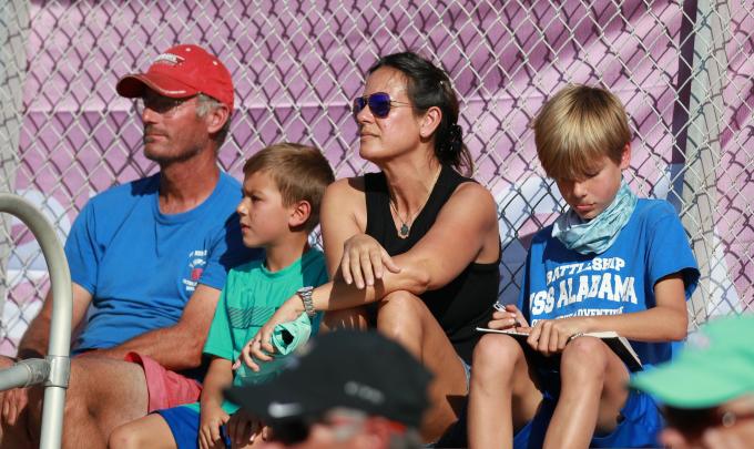 Family watching a soccer game
