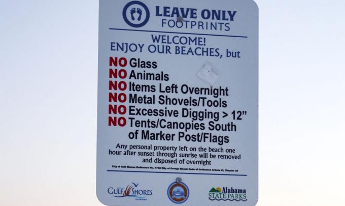 Leave Only Footprints Sign on Beach