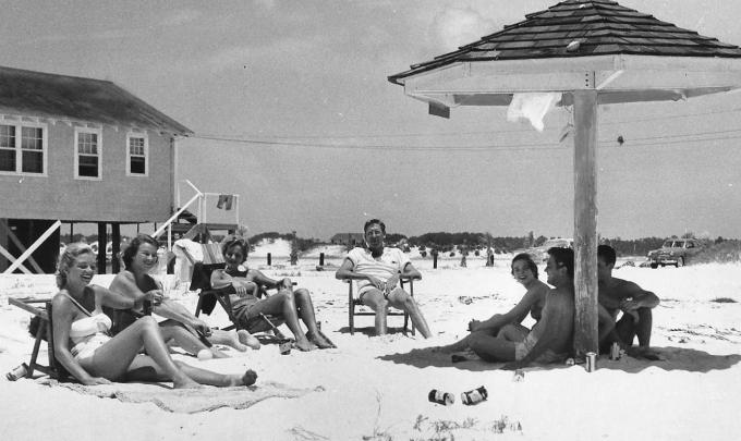 Vintage photo of people enjoying the beach in Gulf Shores in the 1950s.