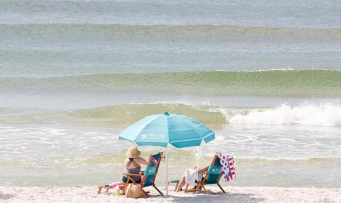 Beach chairs and umbrellas on the beach at The Lodge
