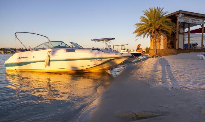 Boat at Flora-Bama Yacht Club waterfront restaurant in Orange Beach