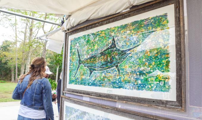 A visitor enjoying the art at the OB Festival of Arts