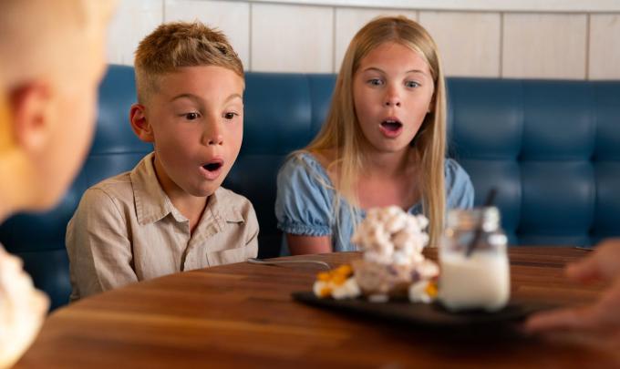 Kids marveling at dessert at Jesse's on the Bay restaurant in Fort Morgan