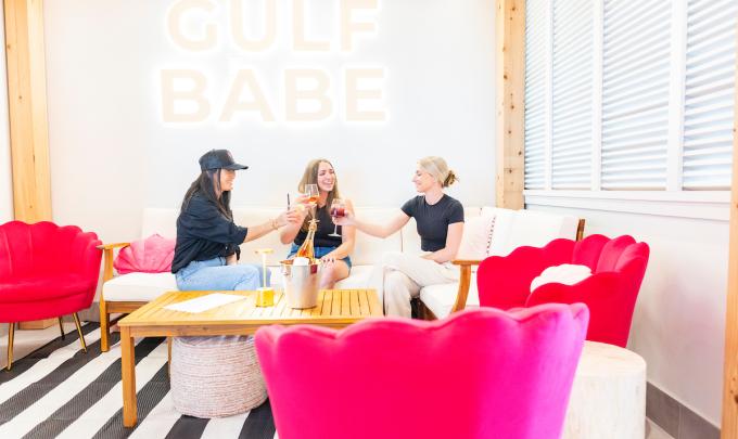 Friends enjoying drinks at Gulf Babe Wine Co. at The Wharf in Orange Beach