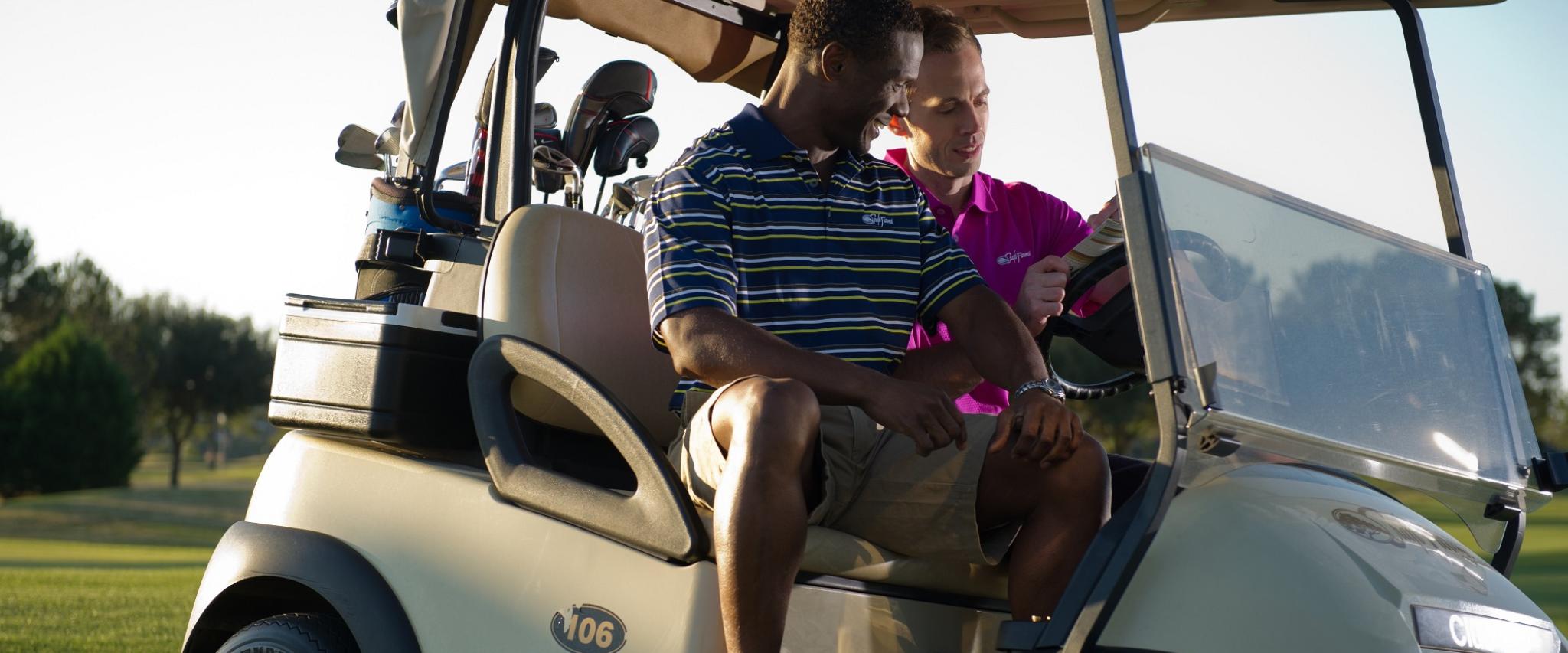 two men in a golf cart Gulf Shores AL