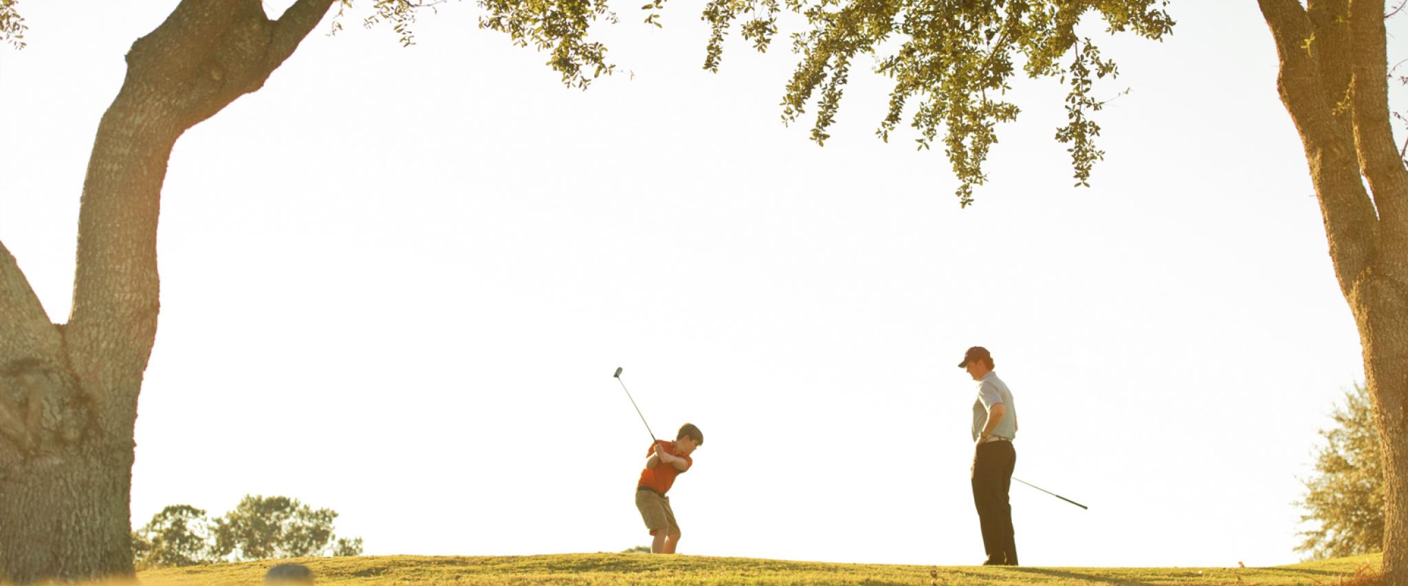 Dad and Son golfing in Gulf Shores AL