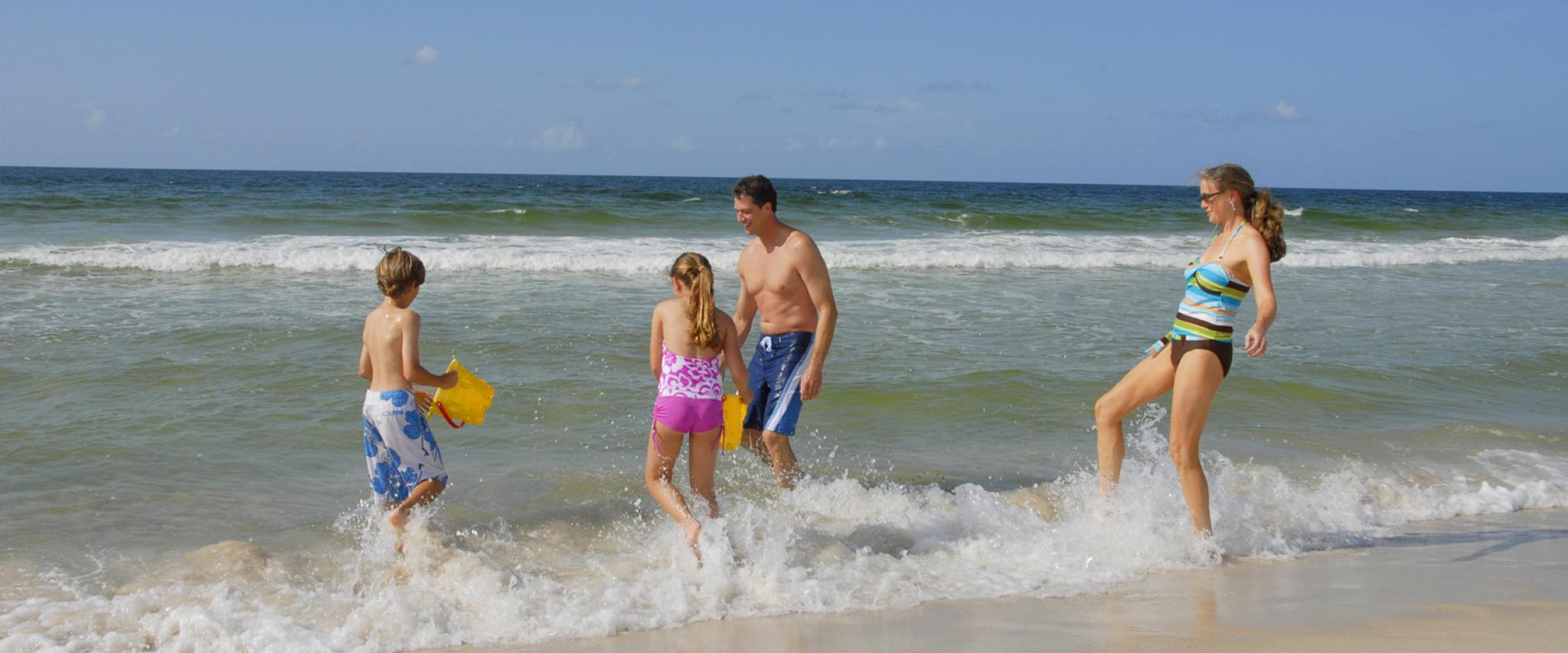 Family plays on Alabama's beaches