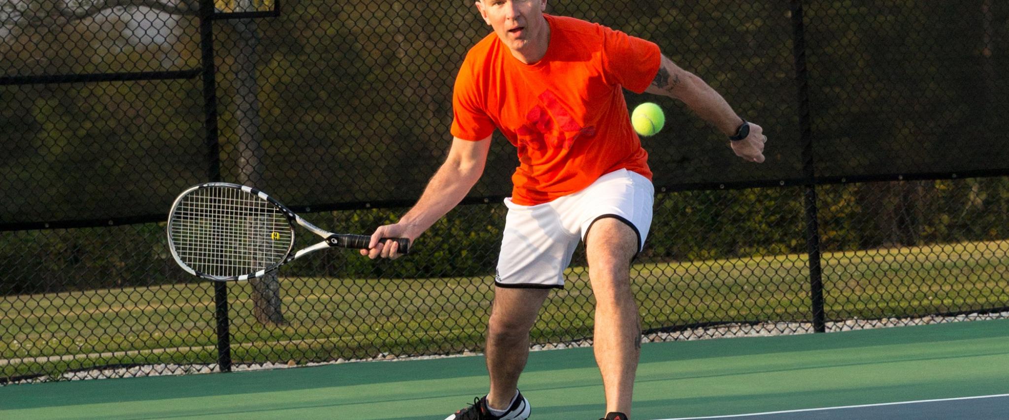 man playing tennis in Orange Beach Al