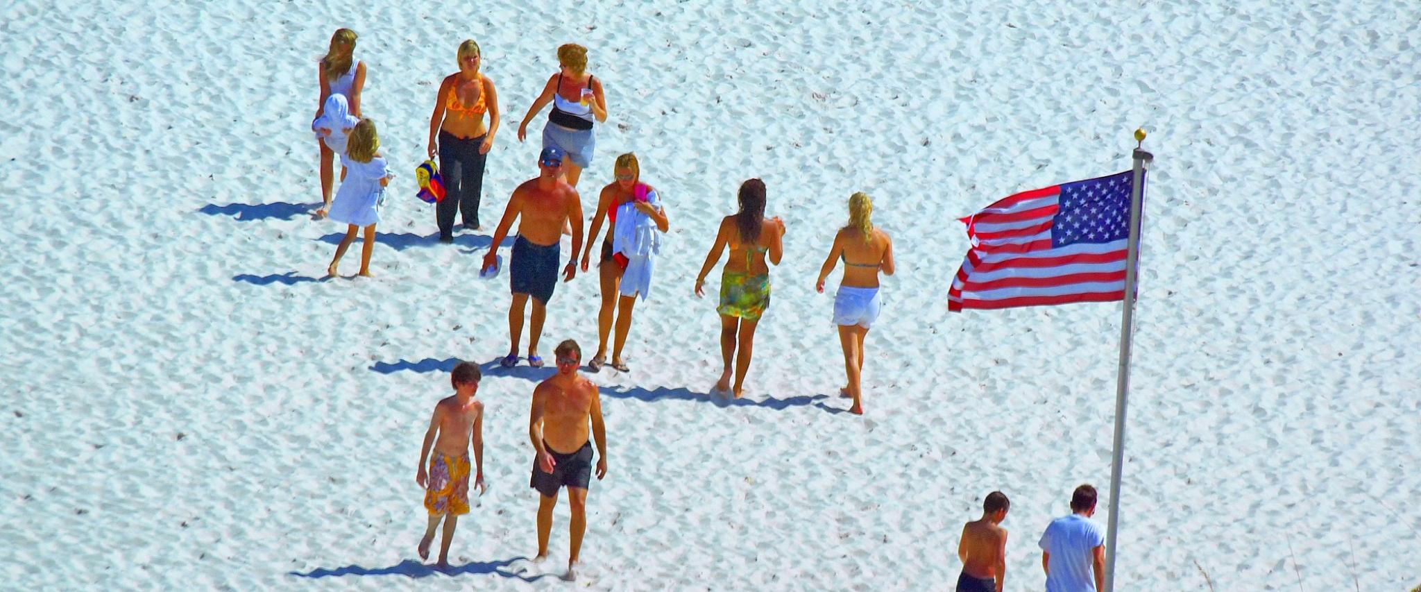 American flag and people on the beach