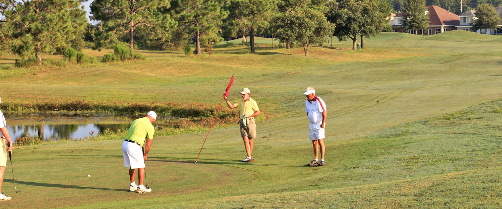 Group of Men play golf in Gulf Shores, AL
