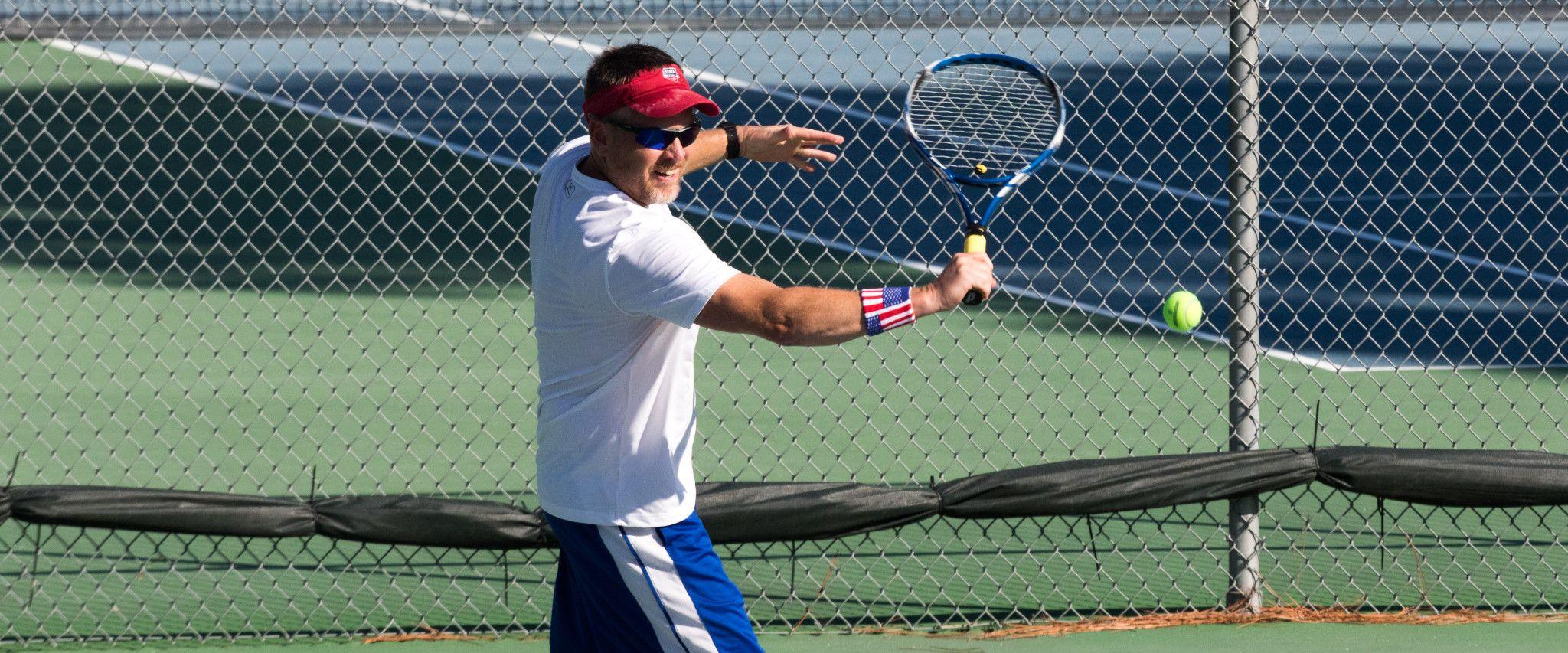 man playing tennis in Gulf Shores AL