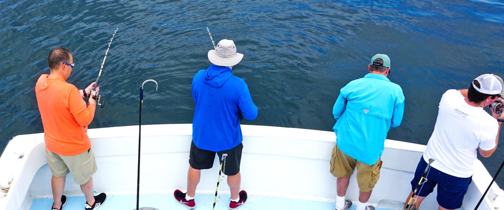 Group of men charter fishing in Orange Beach