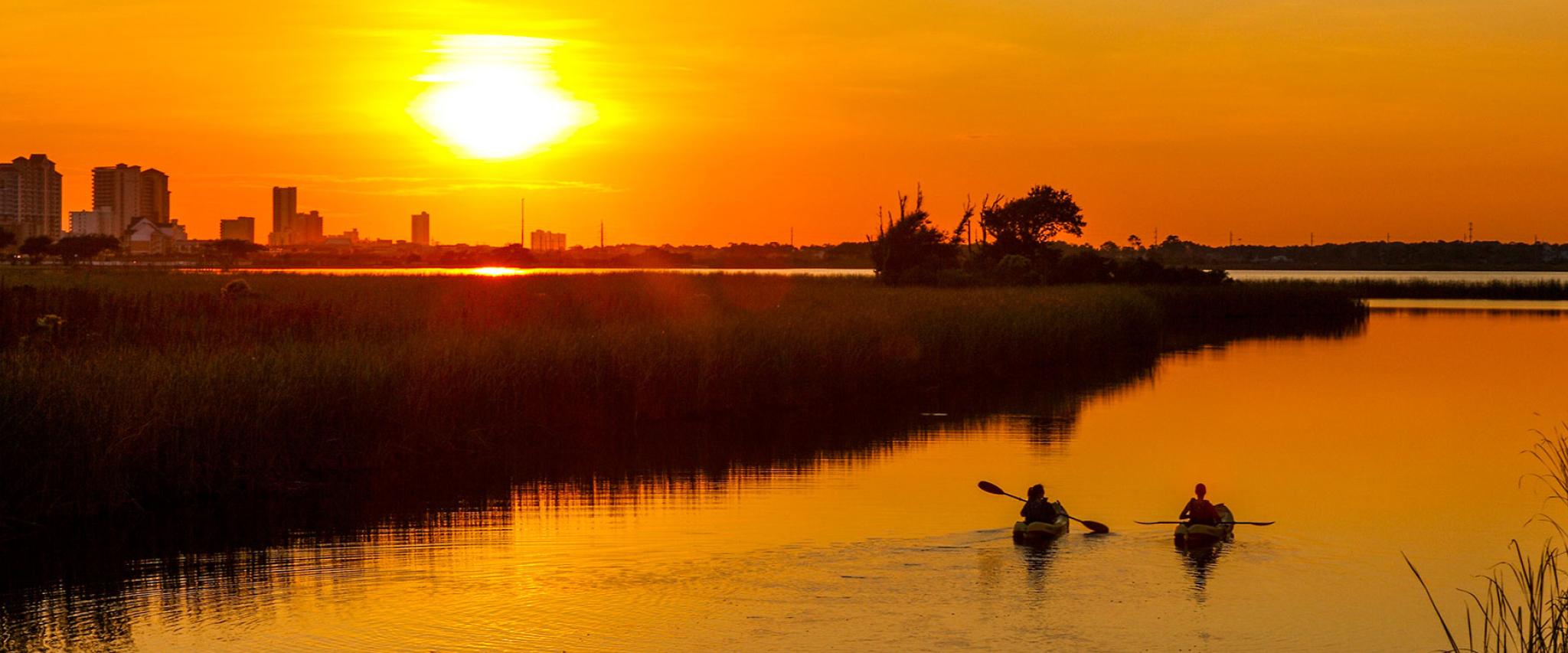 Kayakers watch Sunset in Orange Beach