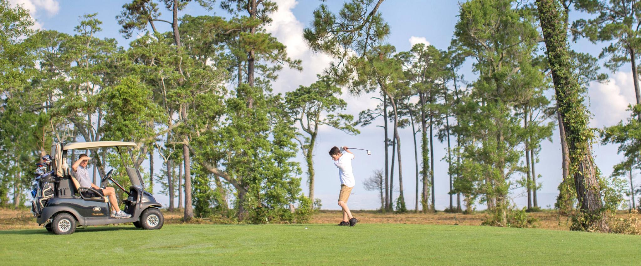 Dad and Son golfing in Gulf Shores Alabama