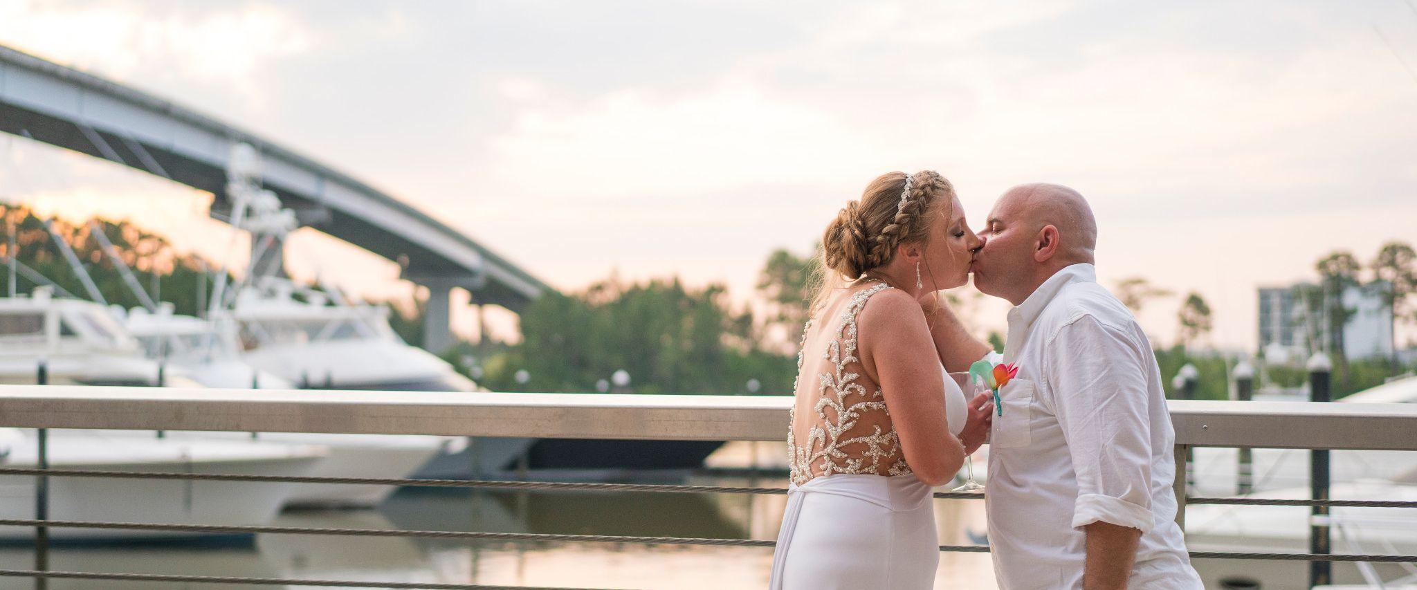 Couple getting married at The Wharf in Orange Beach AL