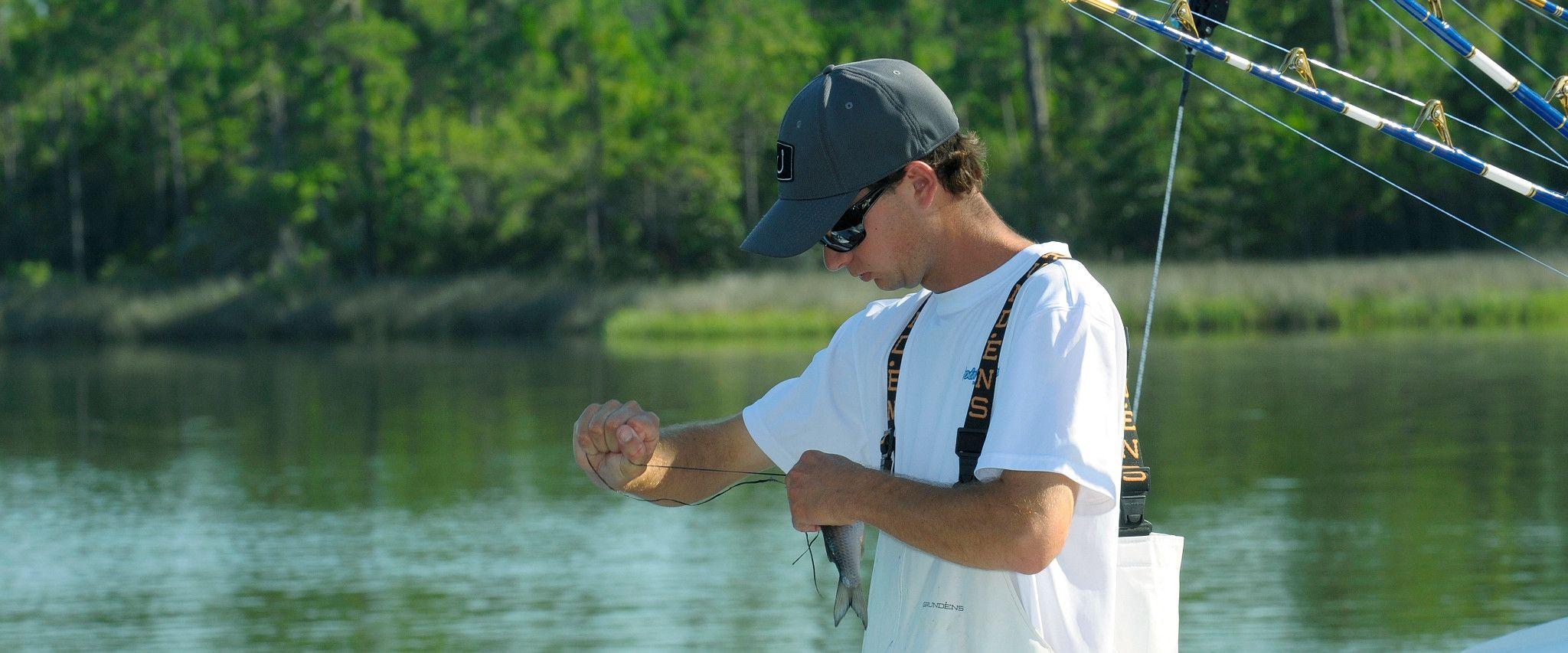 Fisherman preparing his line in Orange Beach, AL
