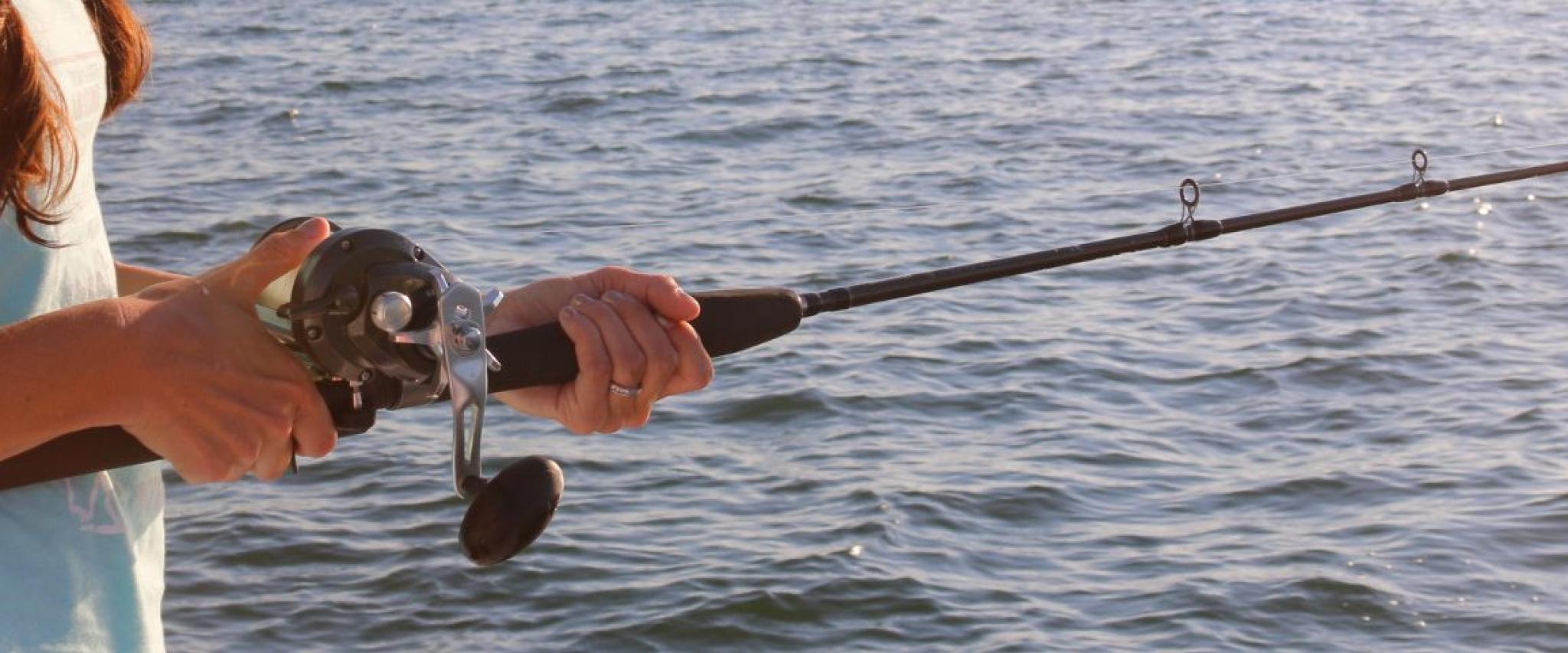 Woman deep sea fishing in Orange Beach, AL