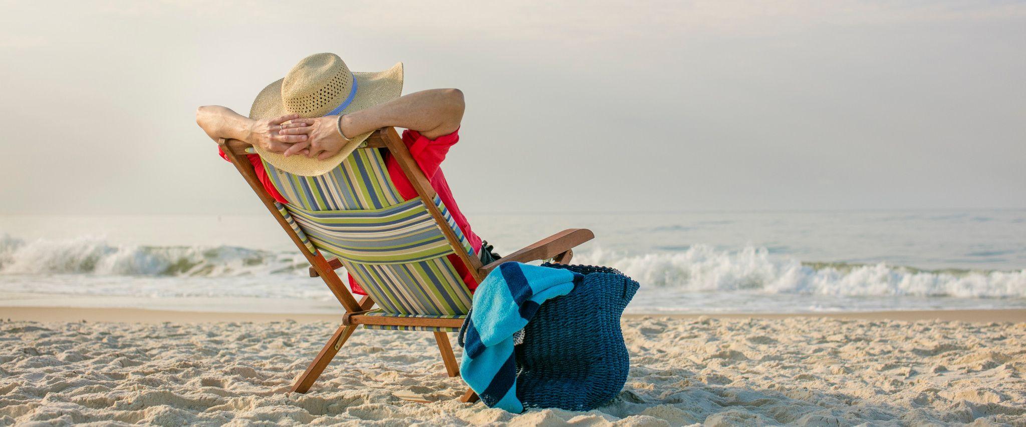 Woman lounging on beach in Gulf Shores, AL