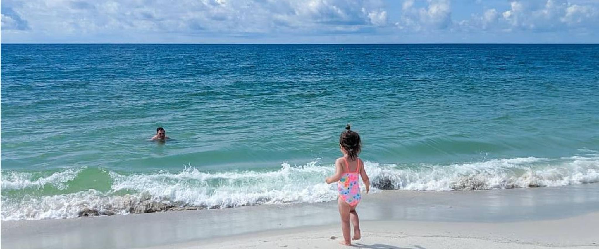 Young girl playing on the beach in Orange Beach, AL