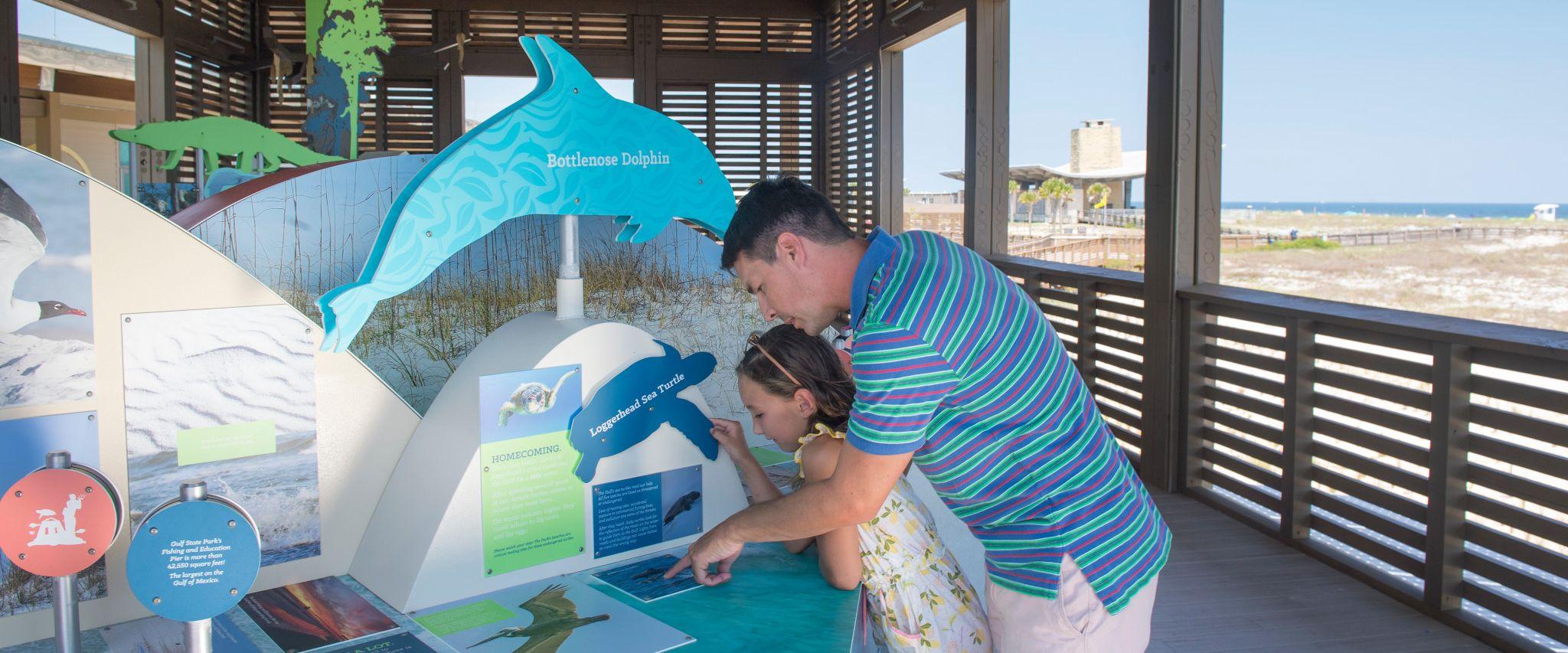 Father and daughter at Gulf State Park Interpretive Center