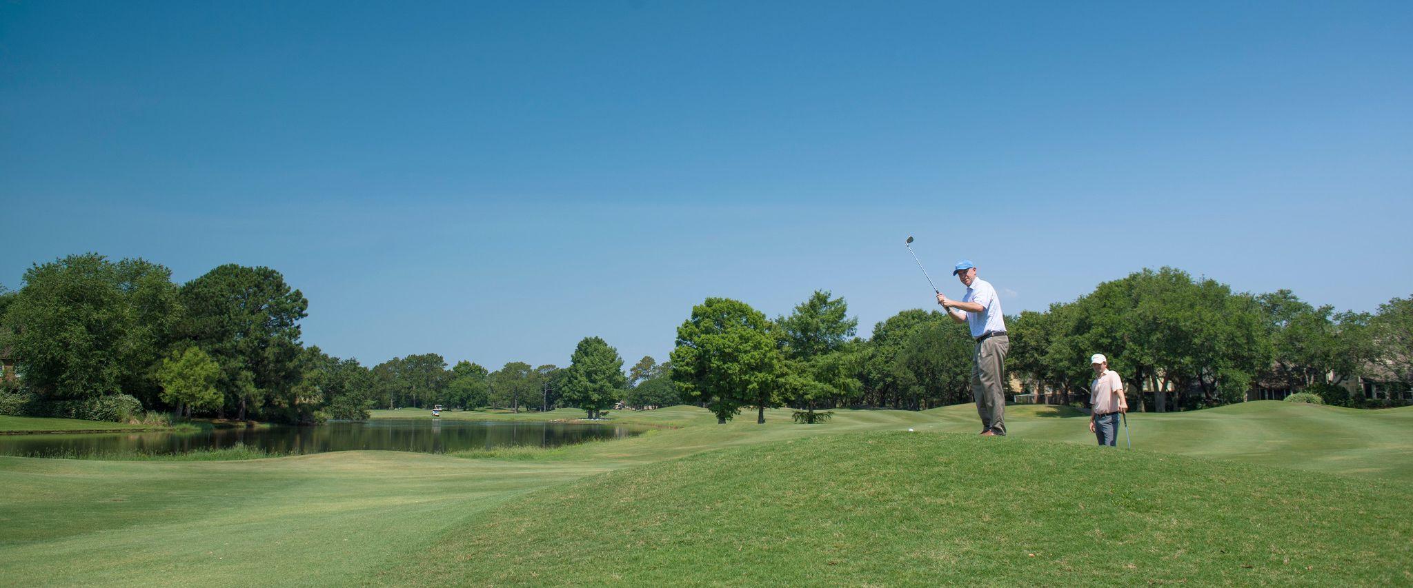 Two men golfing at Craft Farms Golf Resort in Gulf Shores, AL