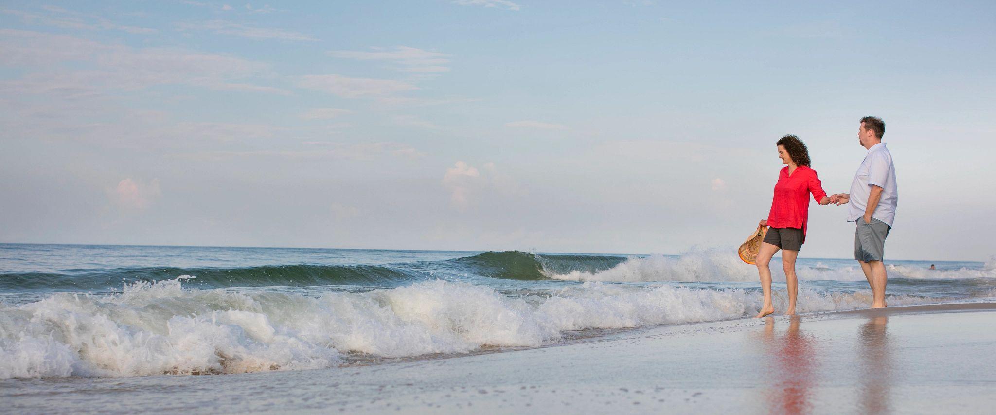 Couple walking on Alabama's beaches