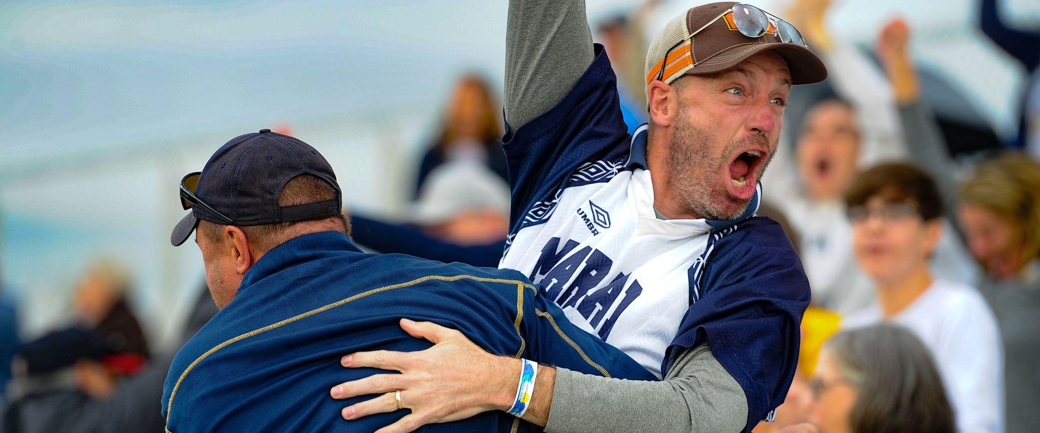 Dads celebrating at NAIA Women's Soccer Championship in Gulf Shores, AL
