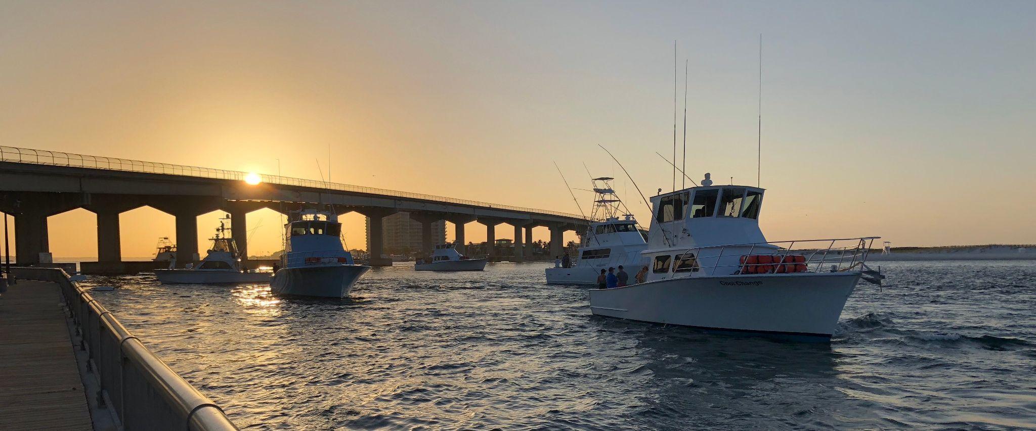 Boaters going into the Gulf of Mexico on Alabama's beaches