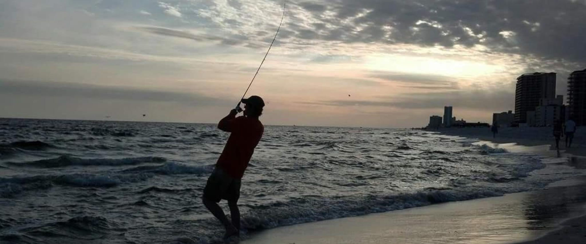 Man shore fishing in Gulf Shores, AL