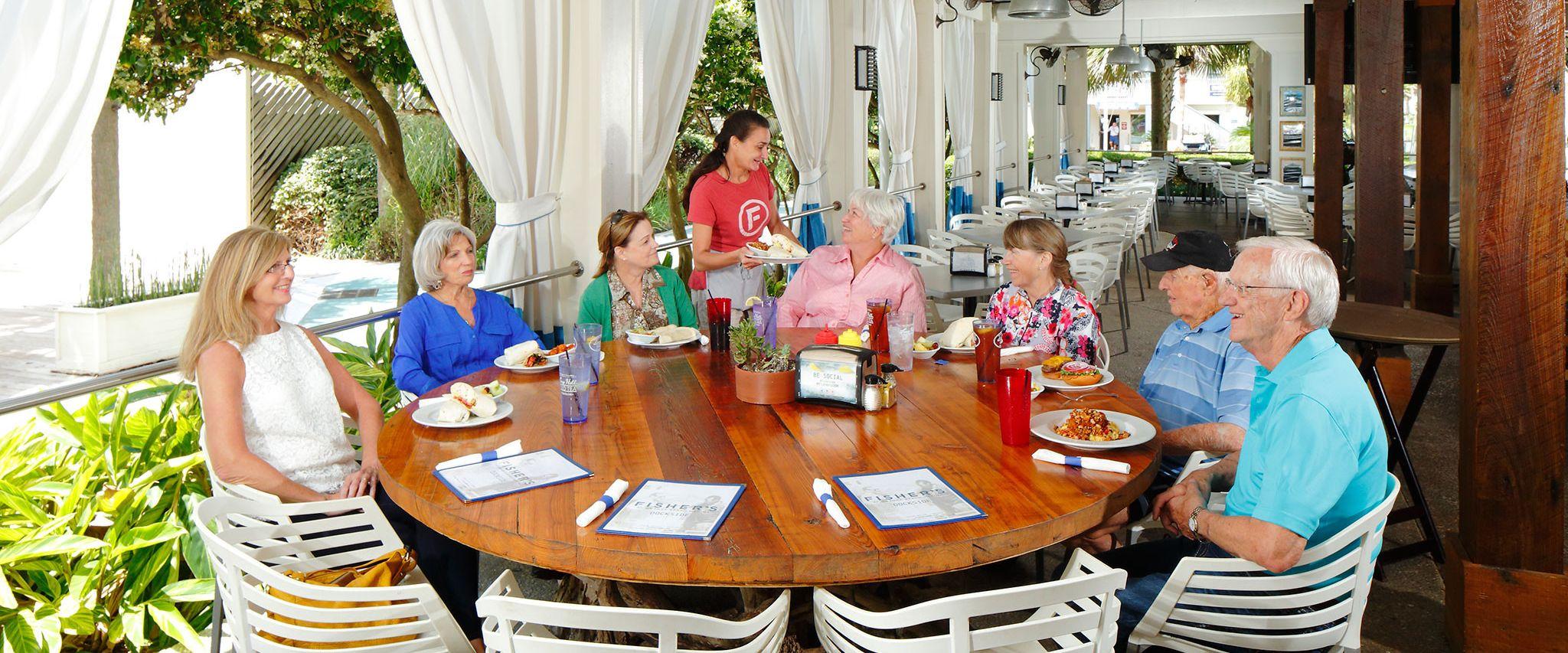 Friends eating at Fisher's in Orange Beach
