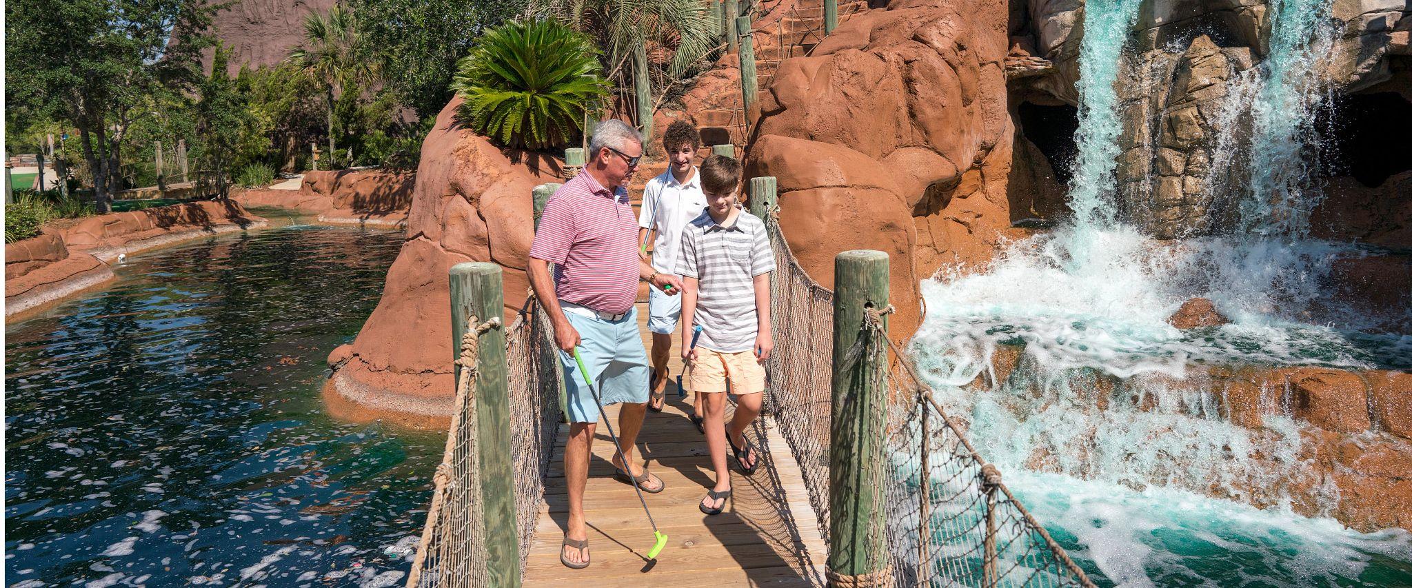 Family playing mini golf at Adventure Island in Orange Beach, AL