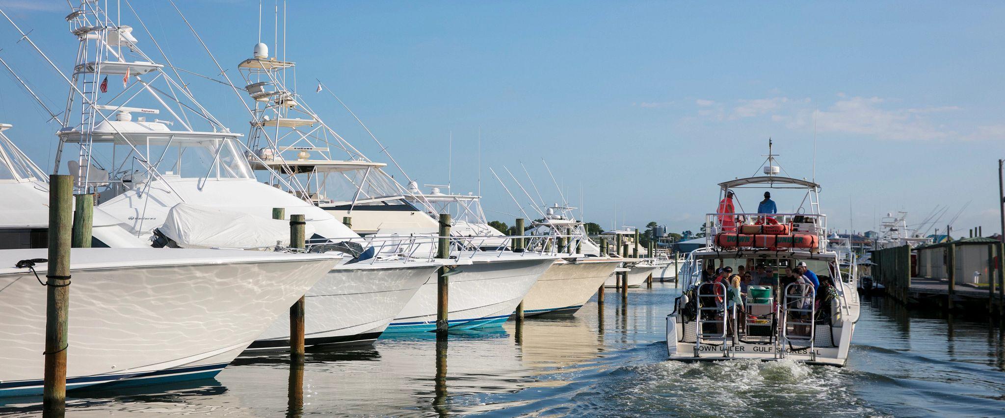 Boat leaving a marina in Orange Beach, AL