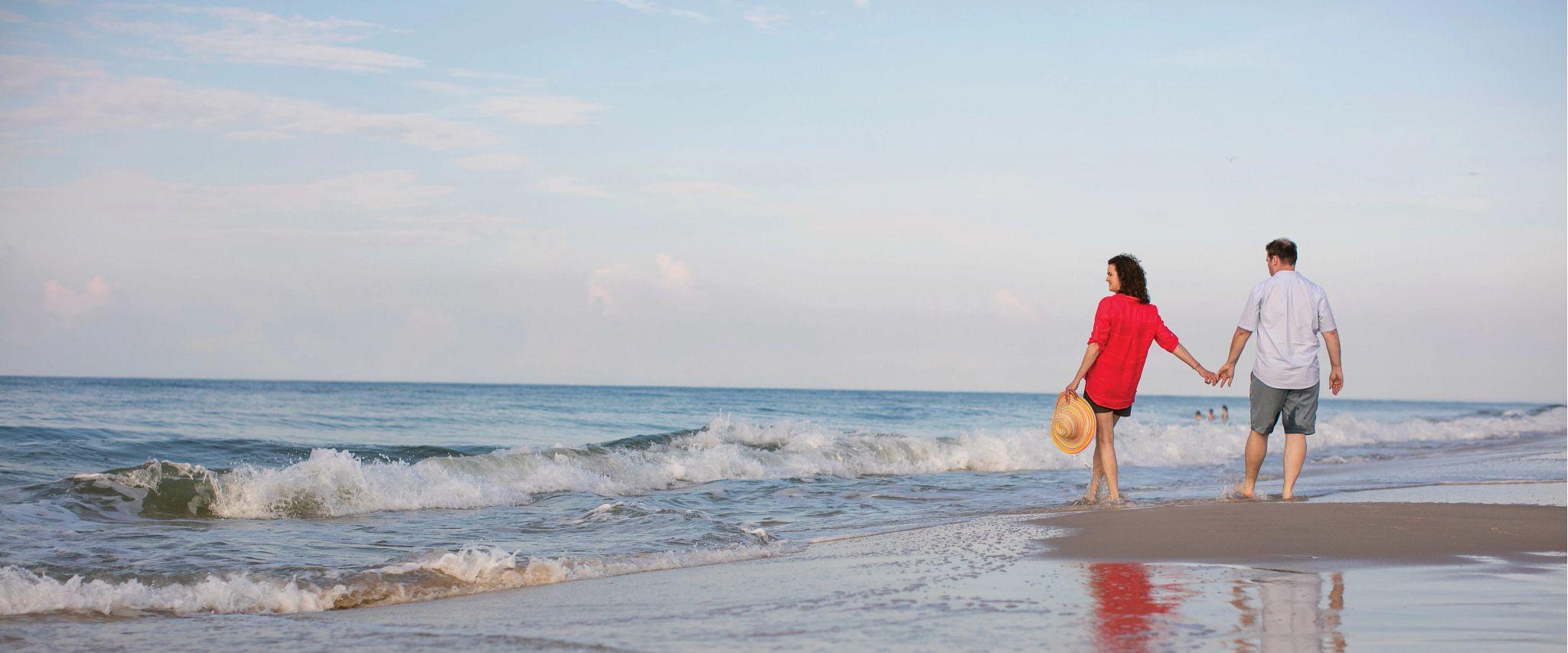 Couple walking on Alabama's beaches