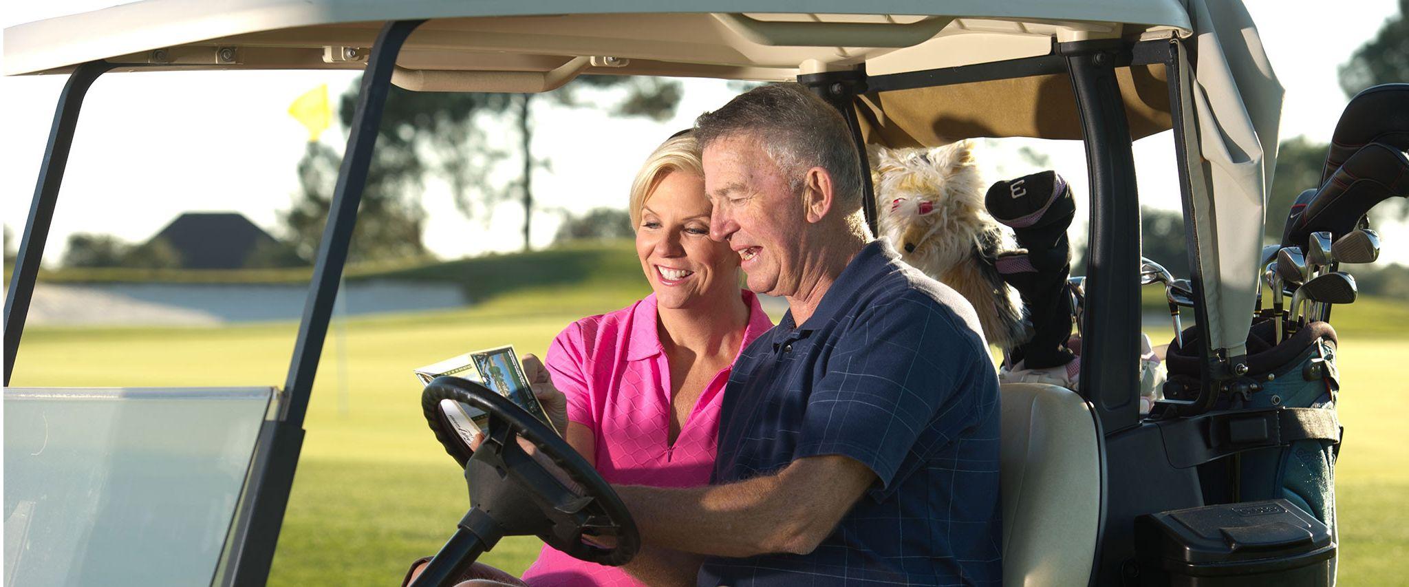 Couple golfing on Alabama Gulf Coast