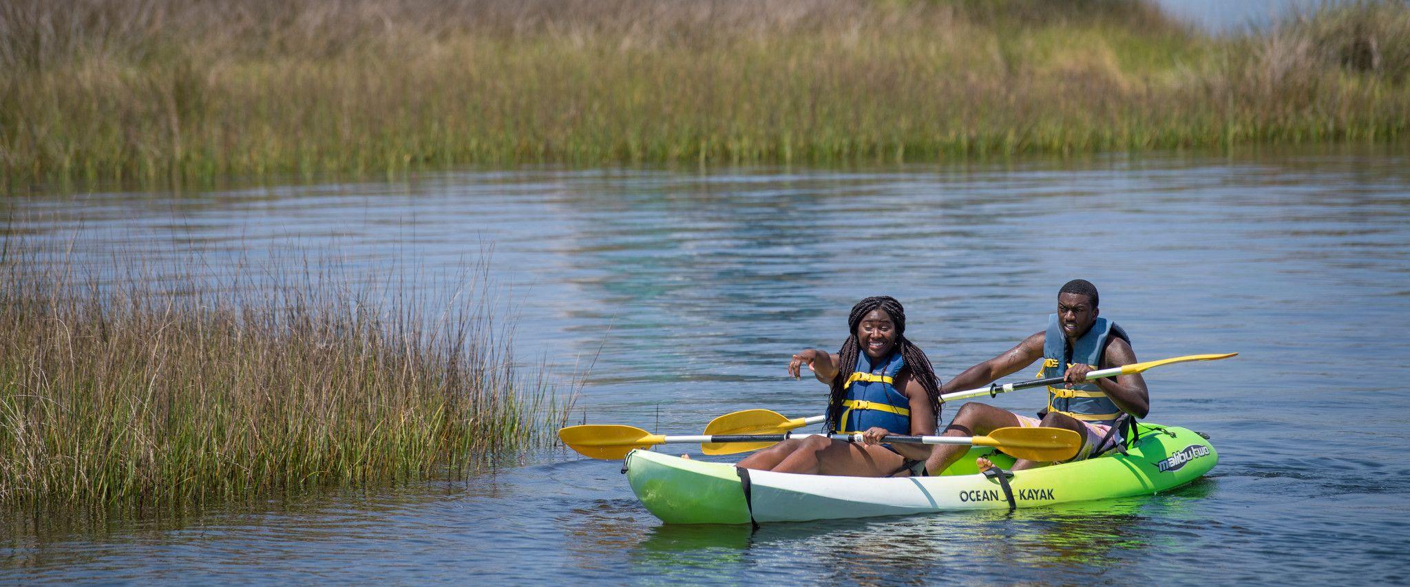 Couple kayaking on Alabama Gulf Coast