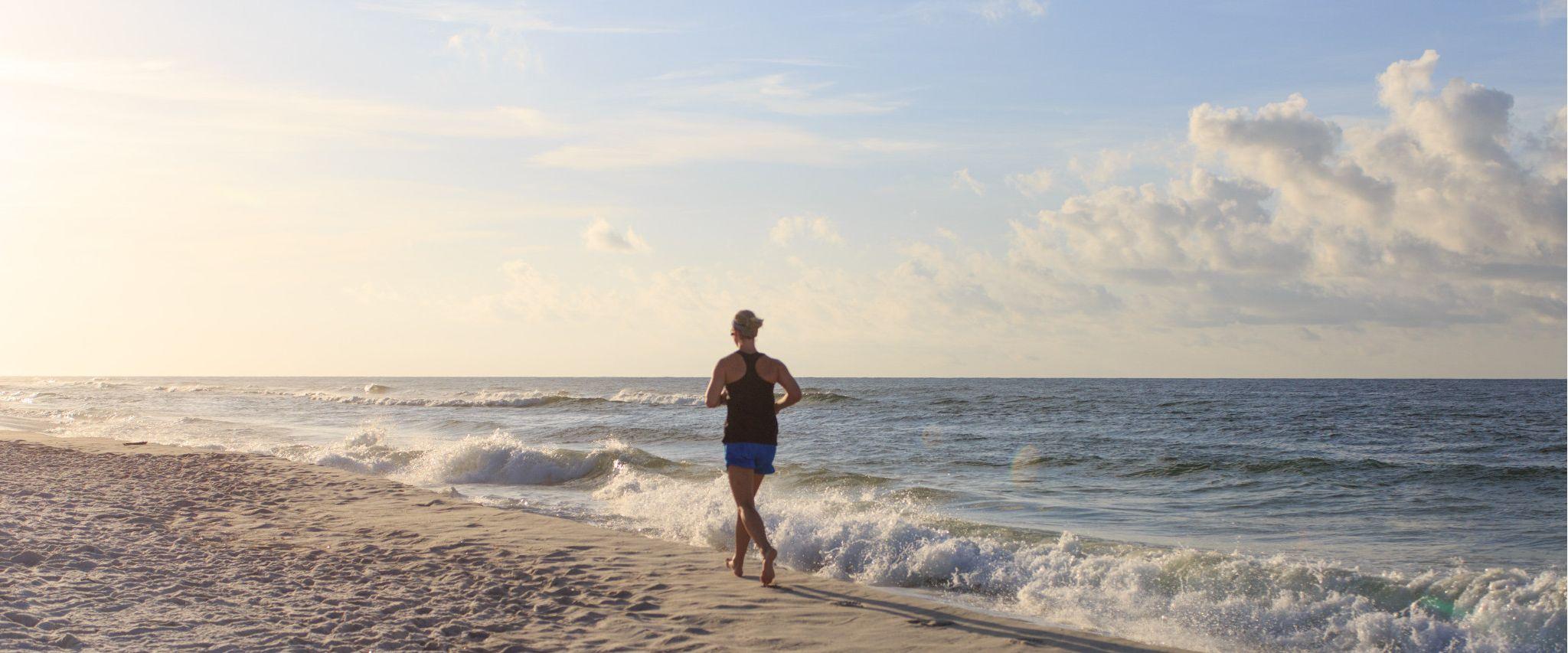 Woman running on the beach in Alabama
