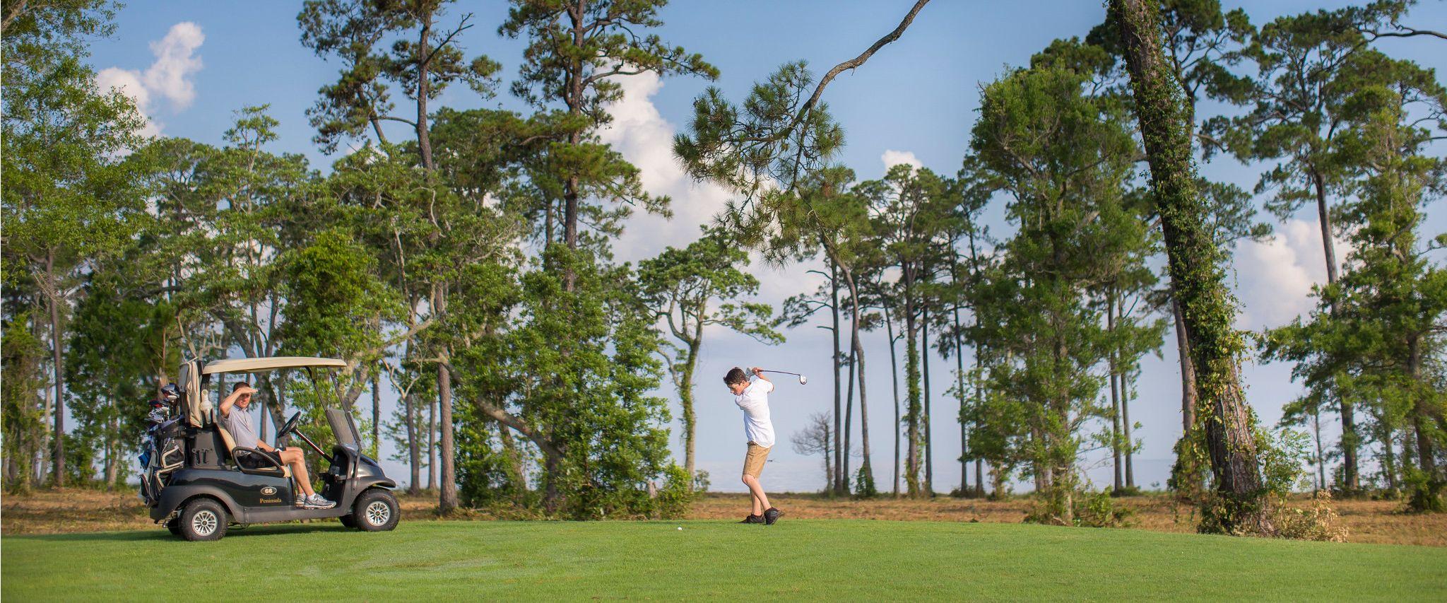 Father and son golfing at Peninsula in Gulf Shores