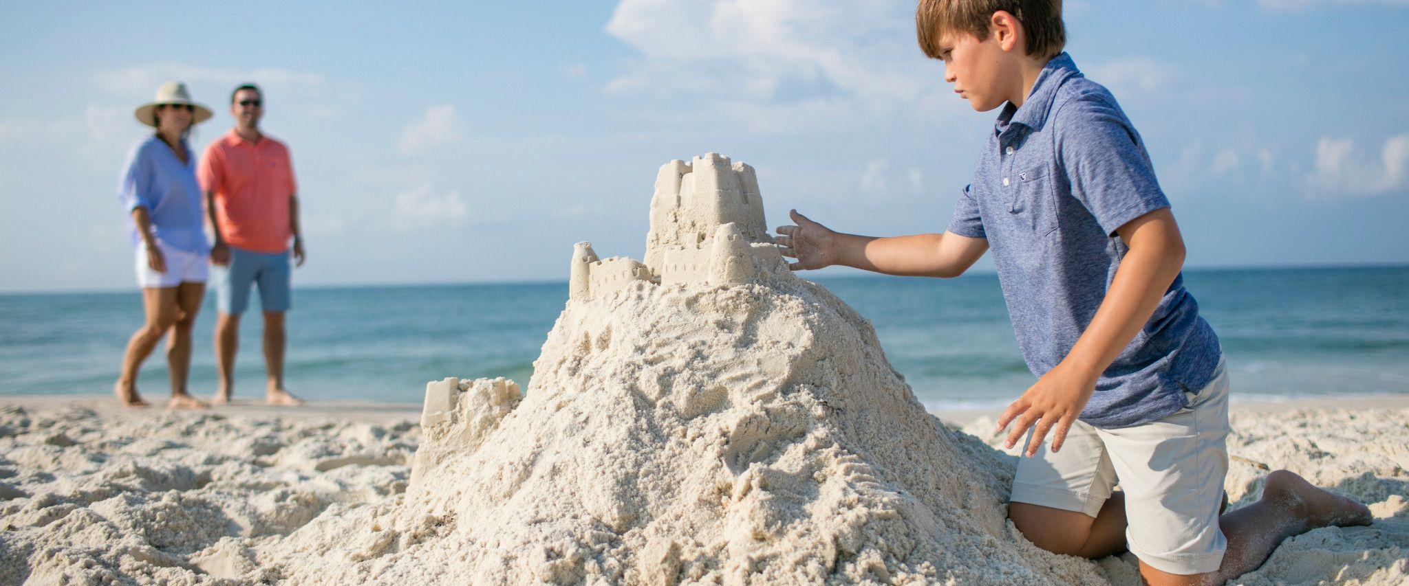 Family building sand castle