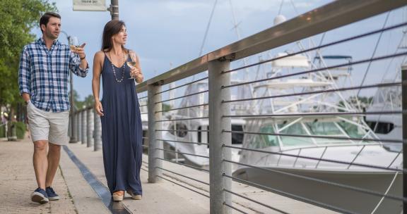 Enjoy a glass of wine along The Wharf's boardwalk.