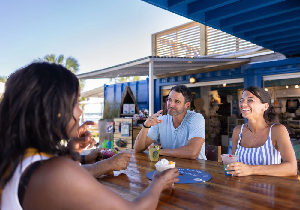 People dining outside at The Gulf waterfront restaurant in Orange Beach