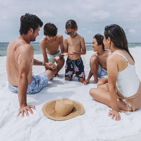 Family enjoying their beach day