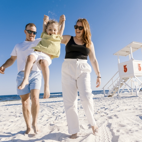 A local family enjoying a day at the beach on Alabama's Beaches