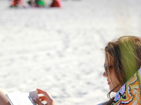 Woman Reading on Alabama's Beaches