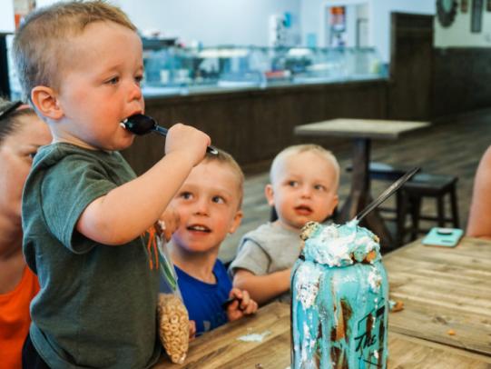 little boys eating ice cream at The Yard Gulf Shores